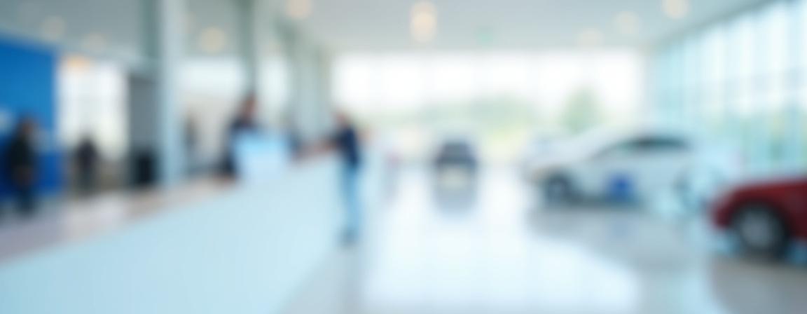 PrimeDrive customer support helping a client at the rental counter