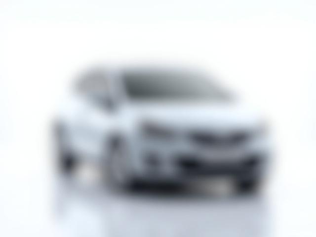 Silver economy hatchback parked in a city street